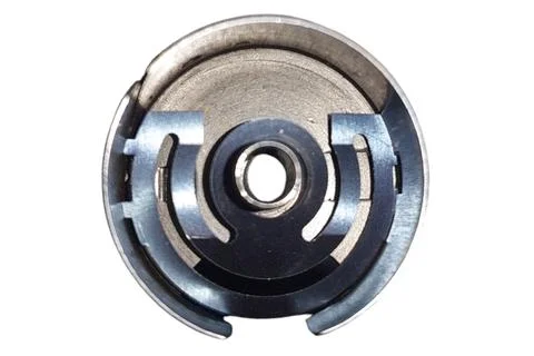 Bobbin case inside view. Part from a sewing machine Stock Photos