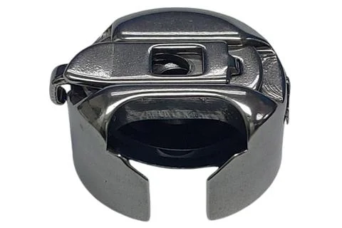 Bobbin case for vertical hook. Part from a sewing machine Stock Photos