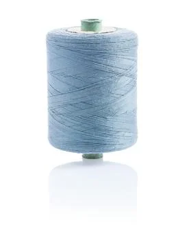 A bobbin with grey sewing string Stock Photos