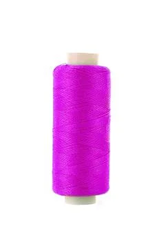 Bobbin with pink thread over white background Stock Photos