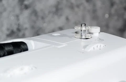 Bobbin on a sewing machine.Close-up. Stock Photos