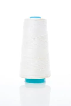 Bobbin of white thread Foto stock