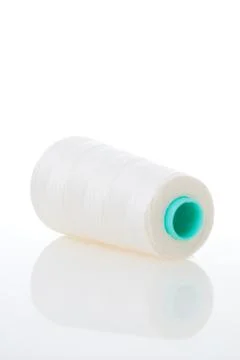 Bobbin of white thread Stock Photos