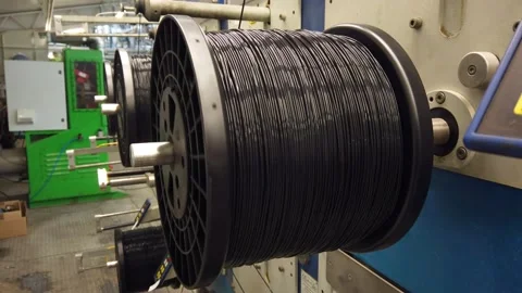 Bobbin winding machine. Detail from a spool with plastic filament Stock Footage 150274937