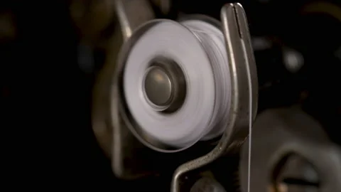 Bobbin winding with thread vintage sewing machine. Close up vintage sewing machi Stock Footage 159684569