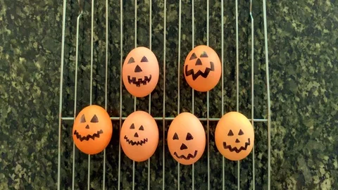 Bobbing halloween pumpkin eggs Stock Footage 116777223