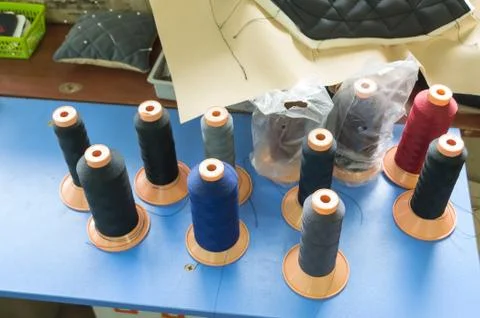 Bobbins with colored threads Stock Photos