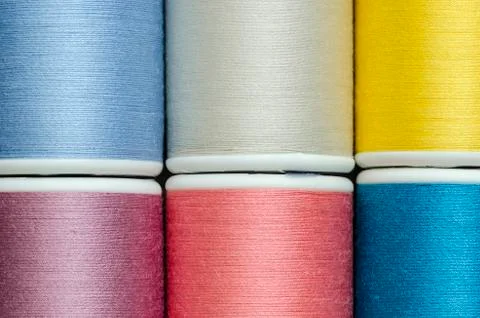 Bobbins with multicolored thread Stock Photos