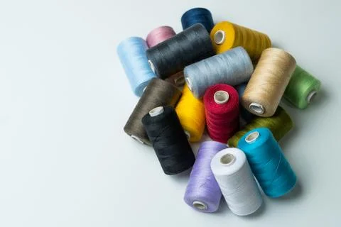 Bobbins of sewing thread on white background Stock Photos