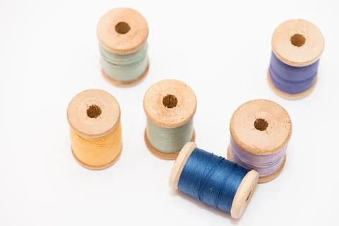 Bobbins of thread isolated on white background Stockfoto's
