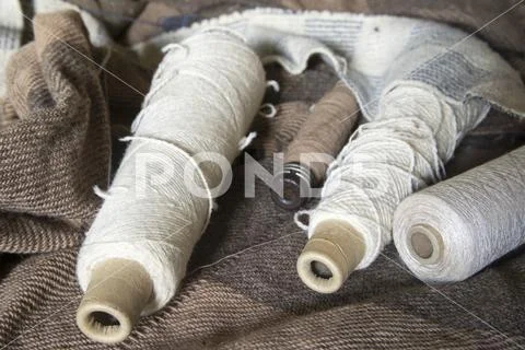 Bobbins of yarn on blanket Stock Photos