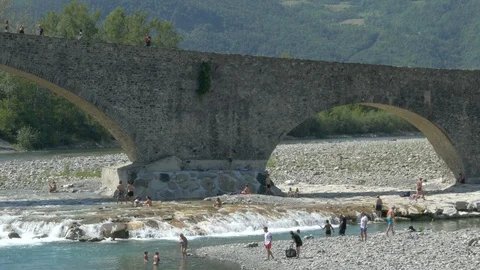 BOBBIO, PC, ITALY – CIRCA AUGUST 2018: People take a bath in the creek. Stock Footage 94094458