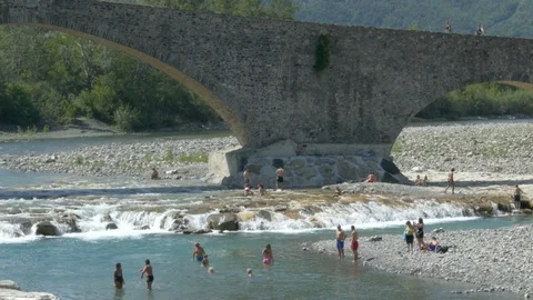 BOBBIO, PC, ITALY – CIRCA AUGUST 2018: Anonymous people enjoy a bath. Stock Footage 94124983