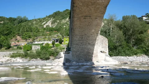 Bobbio, view of the river "Trebbia" and the bridge "Gobbo" ( hunchbacked) Stock Footage 134558340