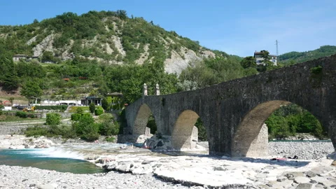 Bobbio, View of the river "Trebbia" and the bridge "Gobbo" ( hunchbacked) Stock Footage 134559546