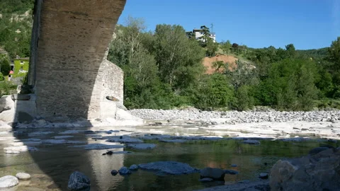 Bobbio, view of the river "Trebbia" and the bridge "Gobbo" (hunchbacked) Stock Footage 134559567