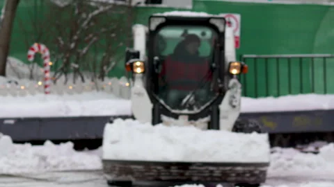 Bobcat, compact snow removal, moving fast and collects the snow Stock Footage 168830510