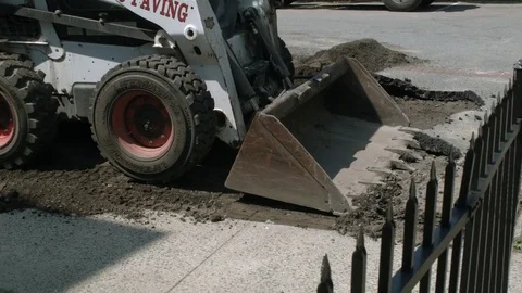 Bobcat Compact Track Loader Breaking Asphalt At Construction Site Stock Footage 76768317