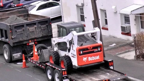 Bobcat front loader tractor, transporter truck 動画素材 74537878