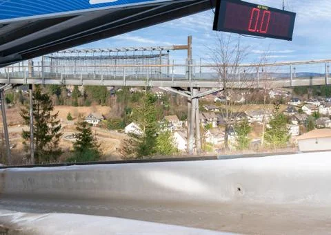 Bobsleigh ice channel in Winterberg. The digital clock measures the speed. Cu Stock Photos