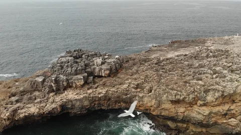 Boca do Inferno touristic sight with people, drone tilt shot, cliff in ocean Stock-Footage 107787195