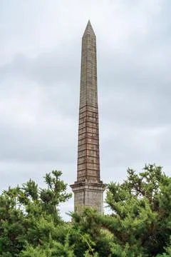 Bodmin Obelisk monument structure in Cornwall against cloudy summer skies Фото