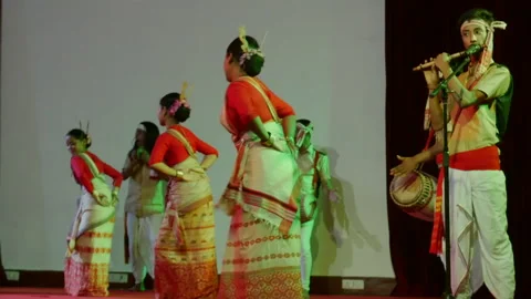Bodo Folk Dancers Performing Circular Steps With Flute Music On Stage 4K 動画素材 346747018