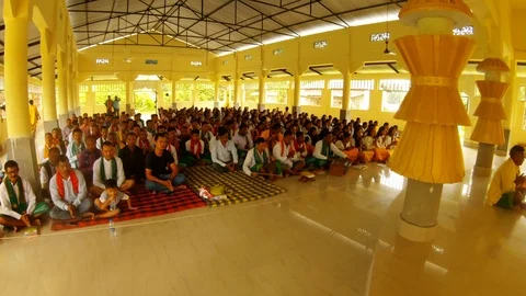 Bodo tribe sit and sing during prayers in the temple of the five elements in the Stock Footage 113291738