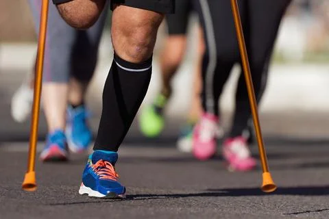The body affected is running a marathon Stock Photos