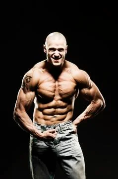 Body Builder Posing - upper body. Strong man flexing muscles Stock Photos