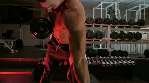Body-builder shakes his arm muscles Stock Footage 75807340
