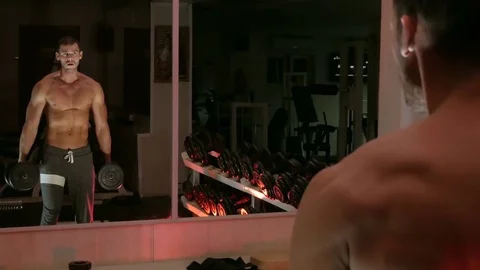 Body-builder shakes his arm muscles Stock Footage 75807638