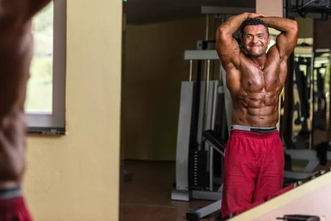 Body builder showing abs Stock Photos