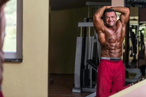 Body builder showing abs Stock Photos
