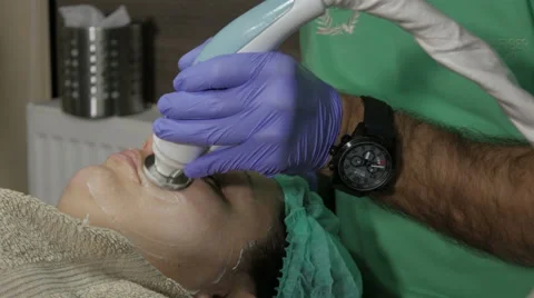 Body care, cleaning face in beauty salon, beautician, facial cleansing, tilt up. Stock Footage 59642705