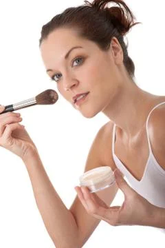 Body care series - young woman applying powder Stock Photos