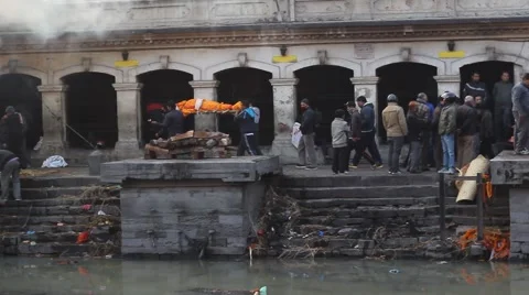 The body of the deceased is carrying along the altars for burning. Pan shot Video stock 59117306