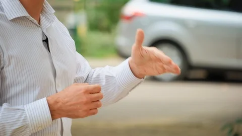 Body language. Male hands gesturing in front of an audience Stock Footage 117683042
