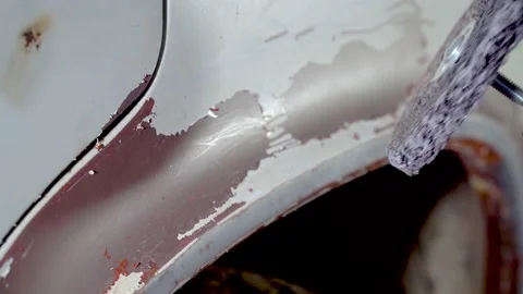 Body master grind old paint from car body using drill with scotch brite circle Stock Footage 133737443
