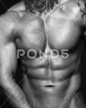 Body part image. Black and white contast photo of sexy mans muscular body. Sexi Stock Photos