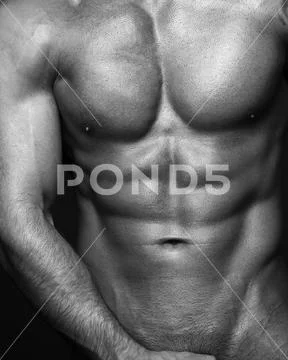Body part image. Black and white contast photo of sexy mans muscular body. Sexi Stock Photos
