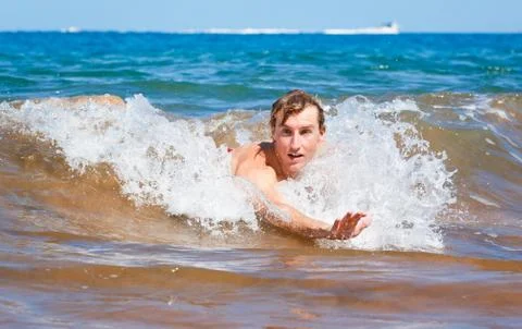 Body surfing at the beach Stock Photos