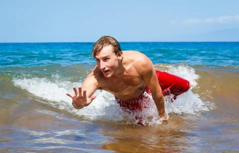 Body surfing at the beach Stock Photos