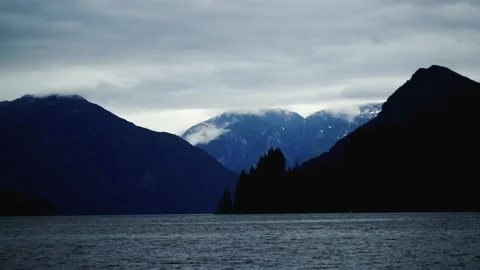 A body of water with a mountain in the background Stock Footage 156014487