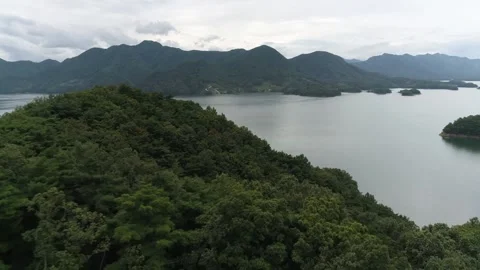 A body of water with a mountain in the background Stock Footage 156333699