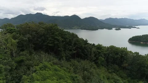 A body of water with a mountain in the background Stock Footage 156340413