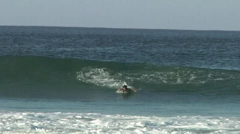 Bodyboarder drop knee Stock Footage 589887