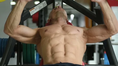 Bodybuilder athletic man workout muscles exercise in gym Video stock 127544824