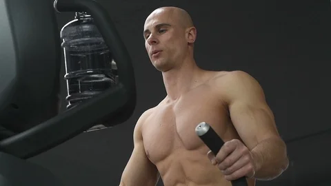 Bodybuilder athletic man workout muscles exercise in gym Video stock 127545188