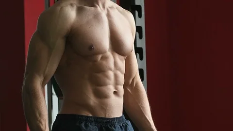 Bodybuilder athletic man workout muscles exercise in gym Video stock 127545214